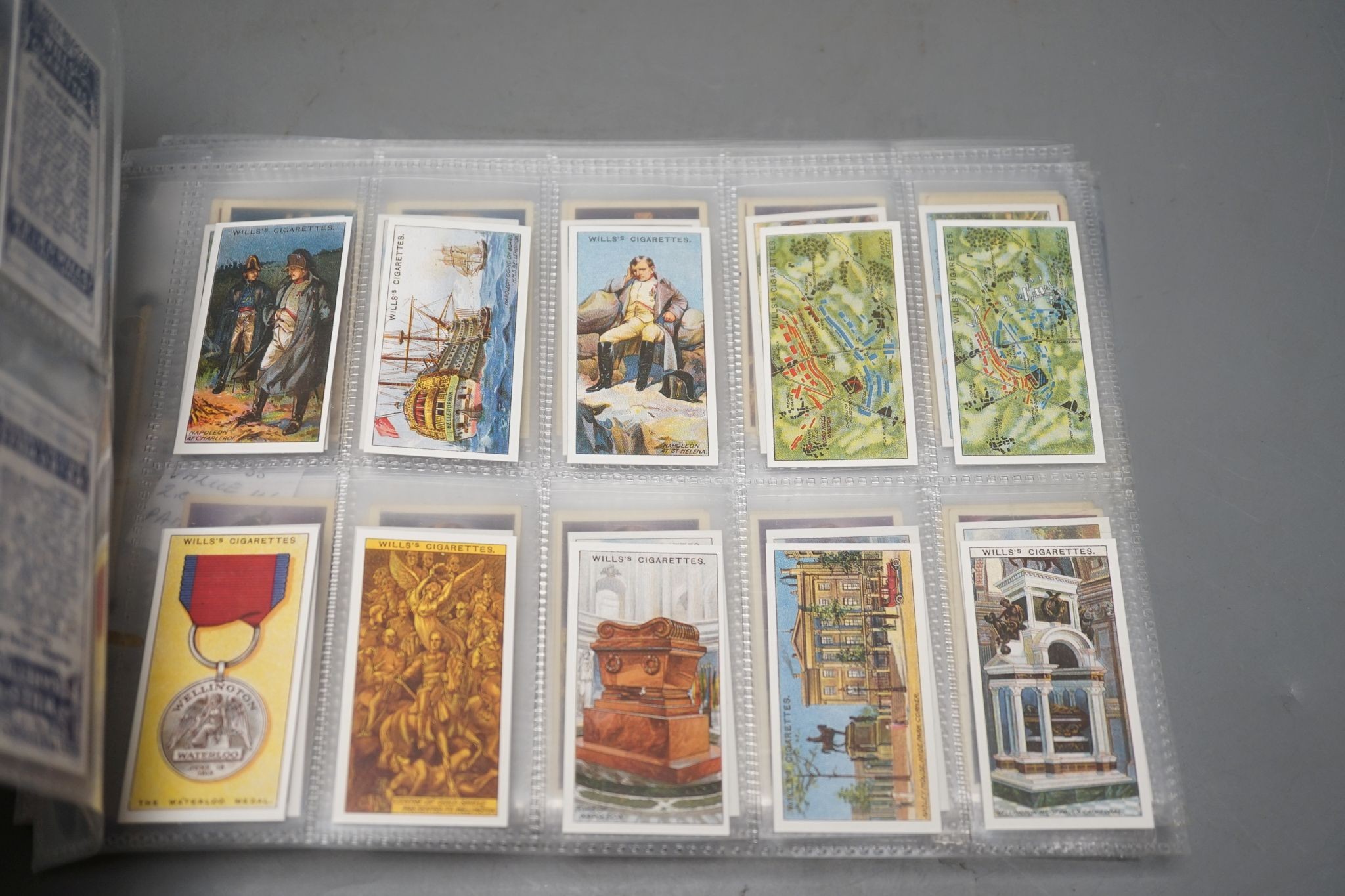 A large collection of pre and post war cigarette cards, in two albums, mounted in a plastic sheets and loose